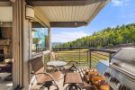 Guests will enjoy mountain views from the furnished outdoor balcony equipped with a gas grill.